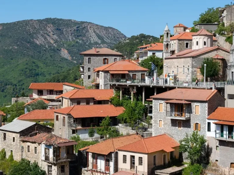 Stone houses and bell tower of Dimitsana in the mountains