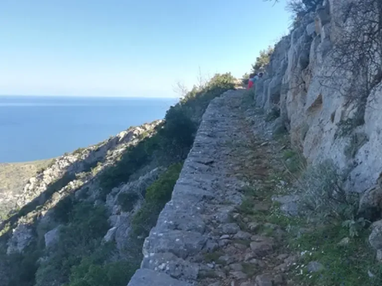 Stone-paved kalderimi path on the cliffside between Melana and Leonidio
