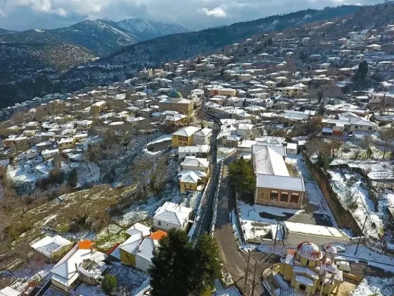 Aerial view of Agios Petros village under snow, Kynouria, Arcadia