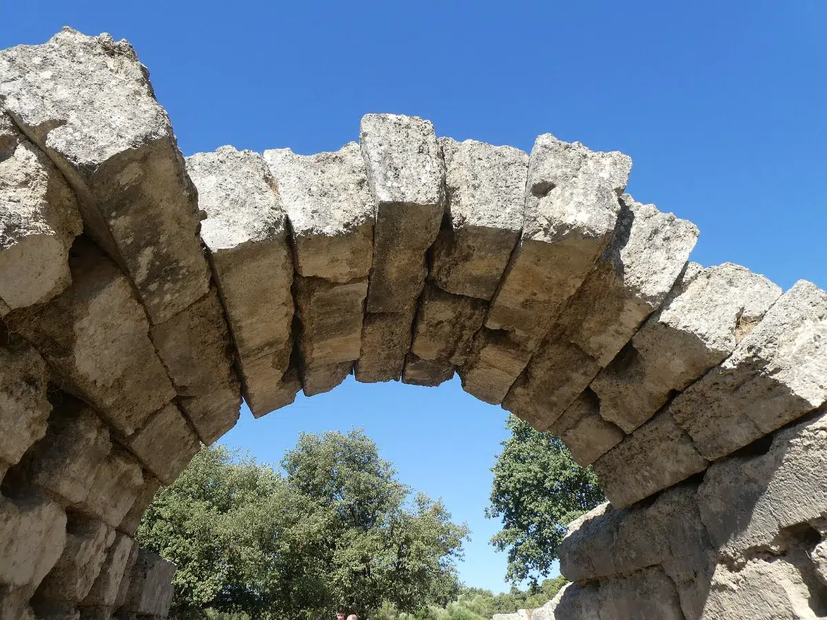 Stone arch at the entrance of the ancient stadium of Olympia