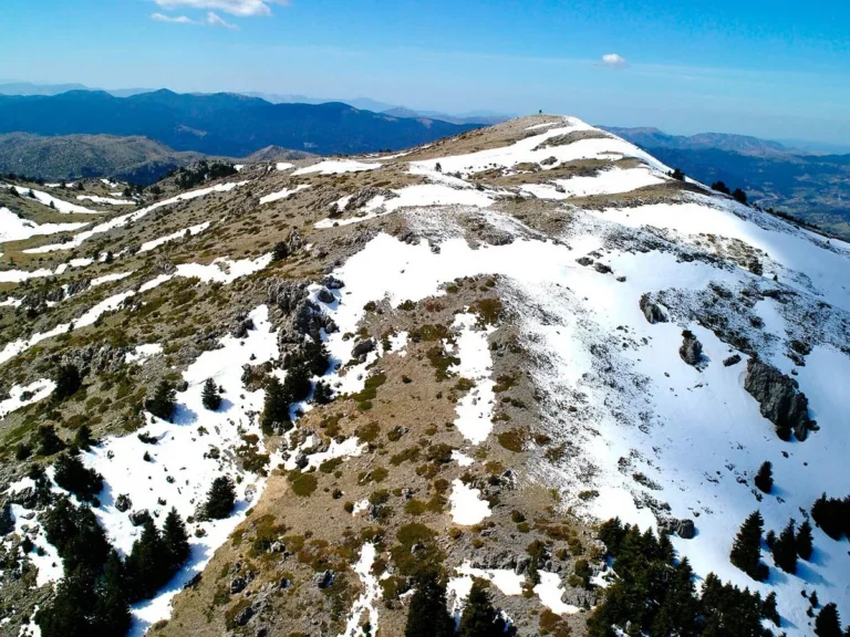 Snow on the peaks of Mount Mainalo in Arcadia